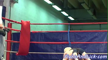 Lesbian babe licks pussy in a boxing ring